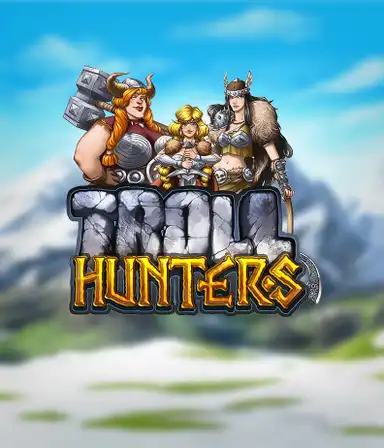 Изображение игрового автомата "Troll Hunters" от Play'N Go, где изображены три воина-викинга: две женщины и один мужчина, одетые в традиционные броню викингов. За их спинами виднеются заснеженные горы, что добавляет атмосферу скандинавской мифологии. Этот слот идеален для поклонников викингских саг и эпических приключений.